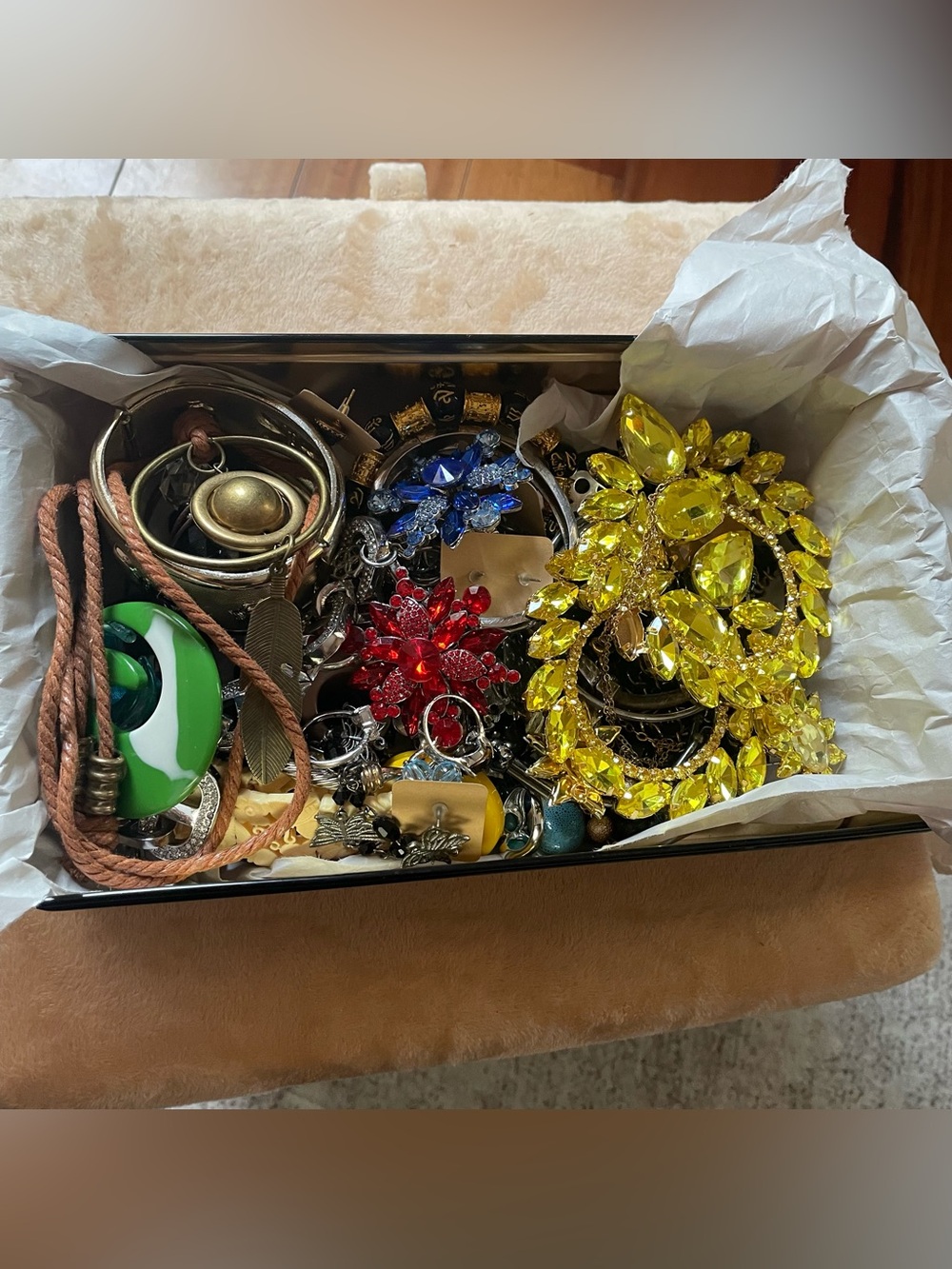 Lots of fashion Jewellery in a Botticelli tin box.